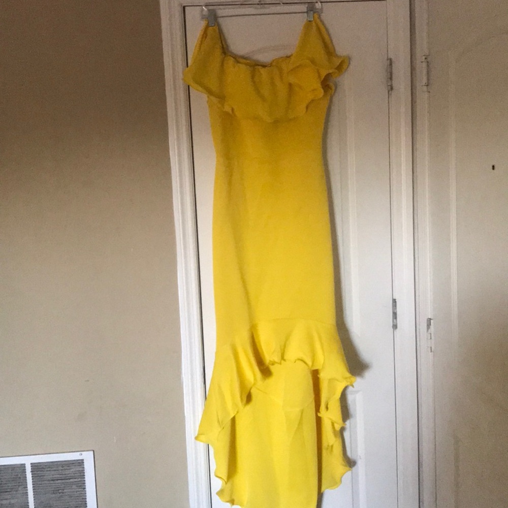 A yellow fitted high low dress